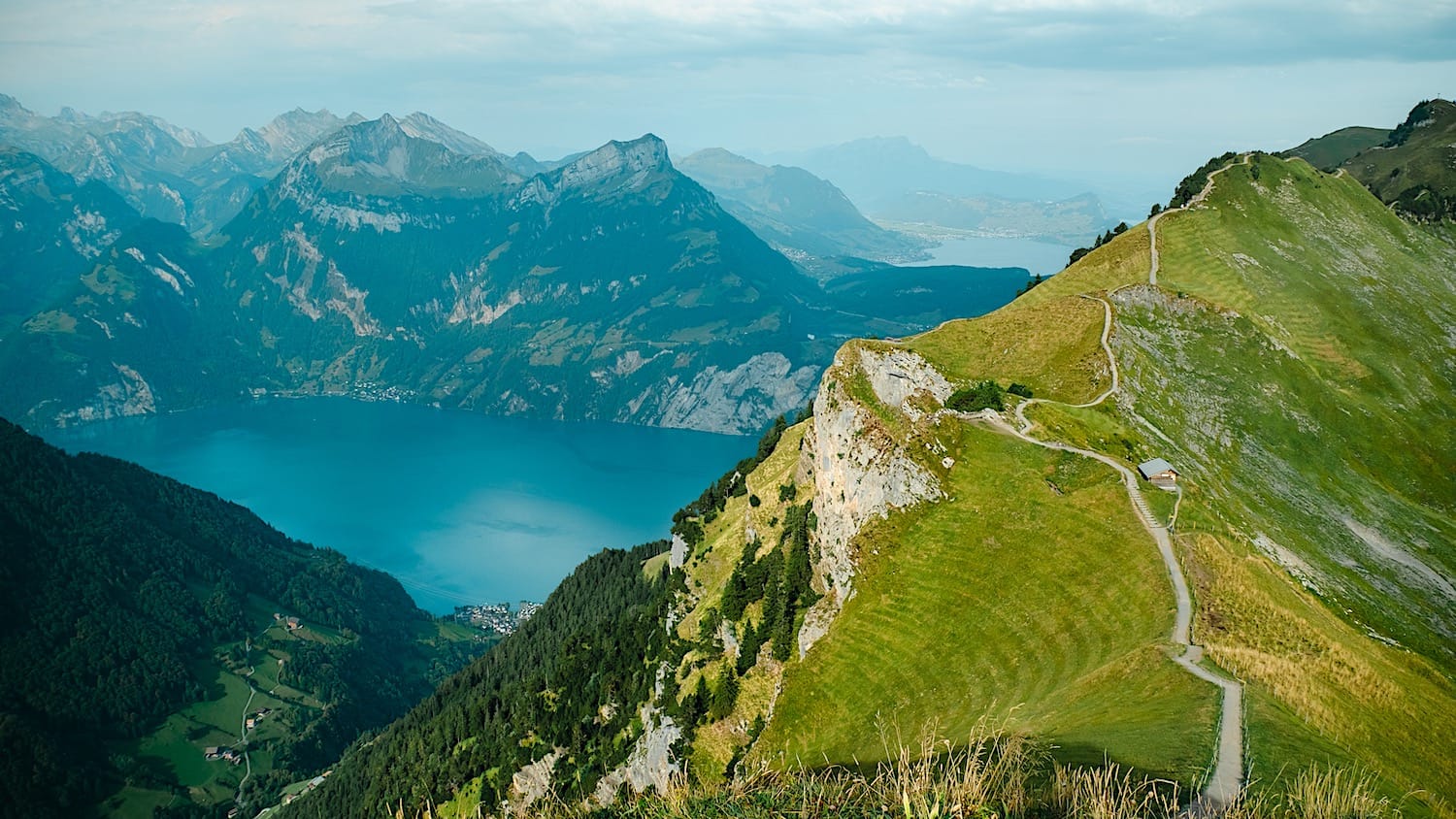 Ridge trail visible, next to the view of lake Lucerne in the background, surrounded by mountains