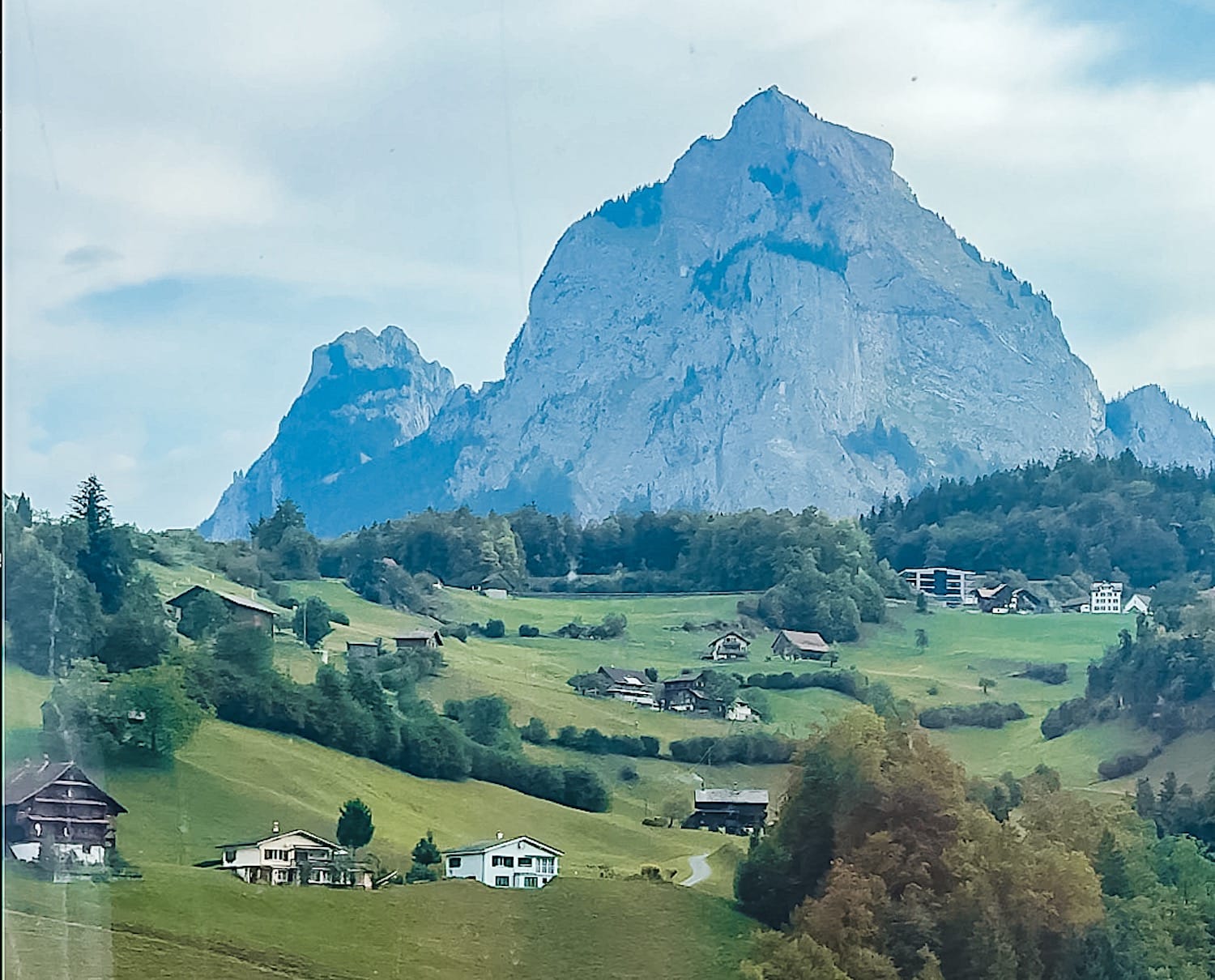 A mountain and a valley below, visible from the funicular.