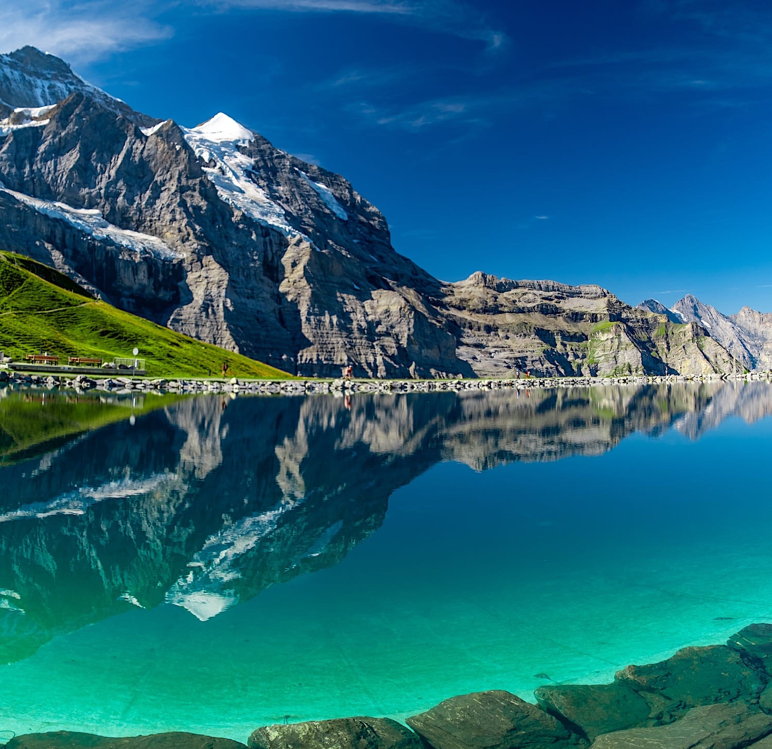 The Eiger and its glacier reflected in the turquoise water of the Fallbodensee